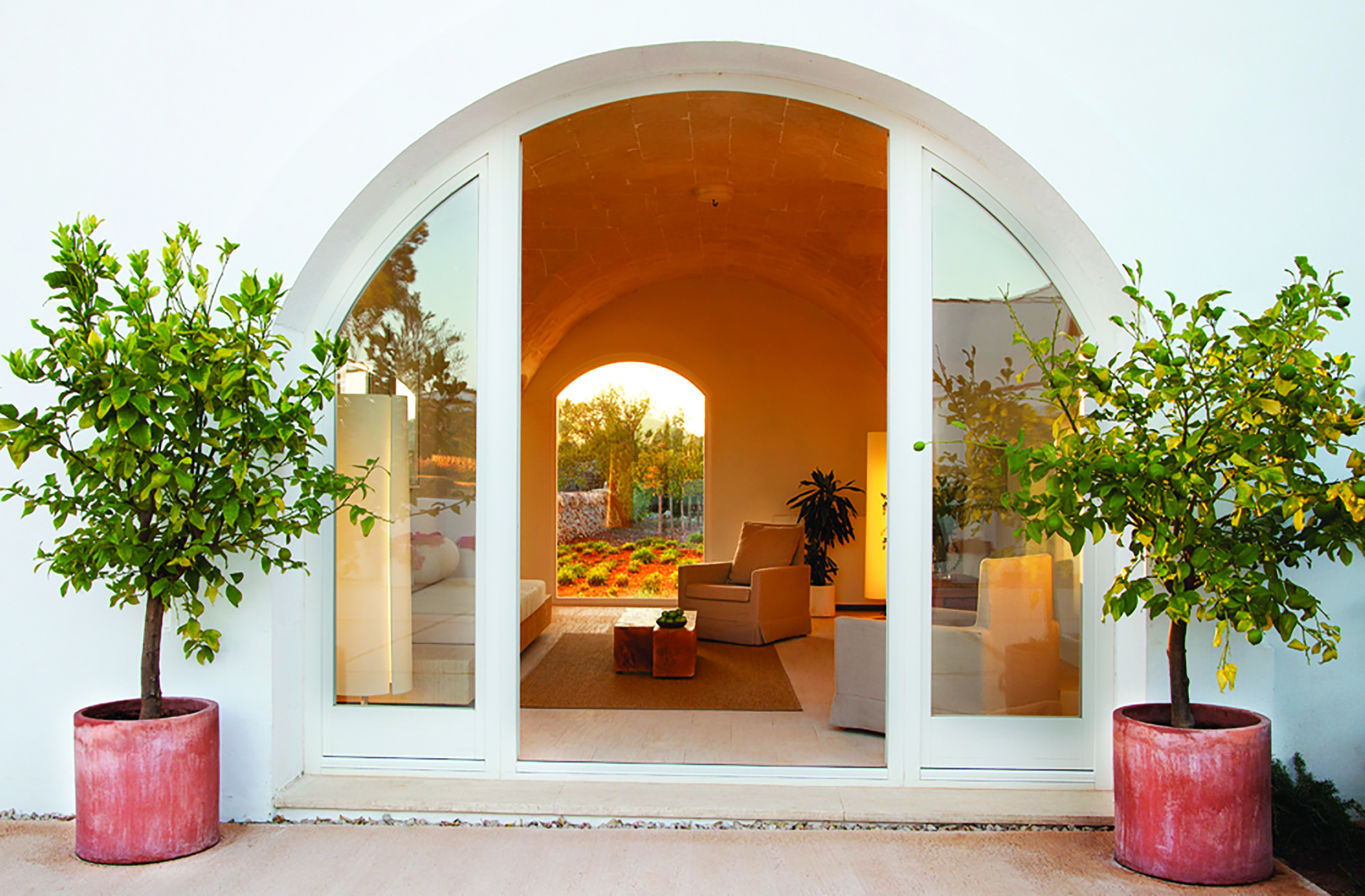Torralbenc Menorca suite entrance garden views armchairs 