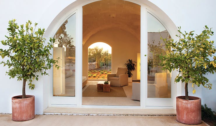 Torralbenc Menorca suite entrance garden views armchairs 