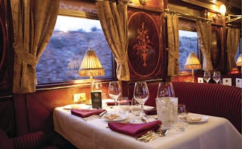 Dining table laid for meal in train carriage