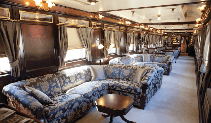 Blue sofas in train carriage