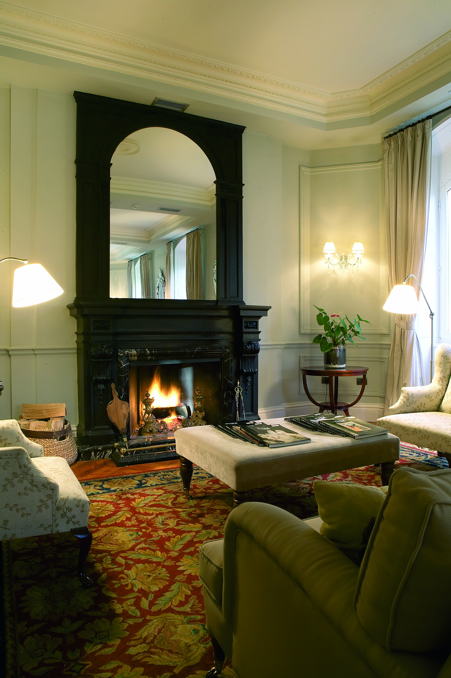 Villa Soro Basque sitting room armchairs open fire elegant décor