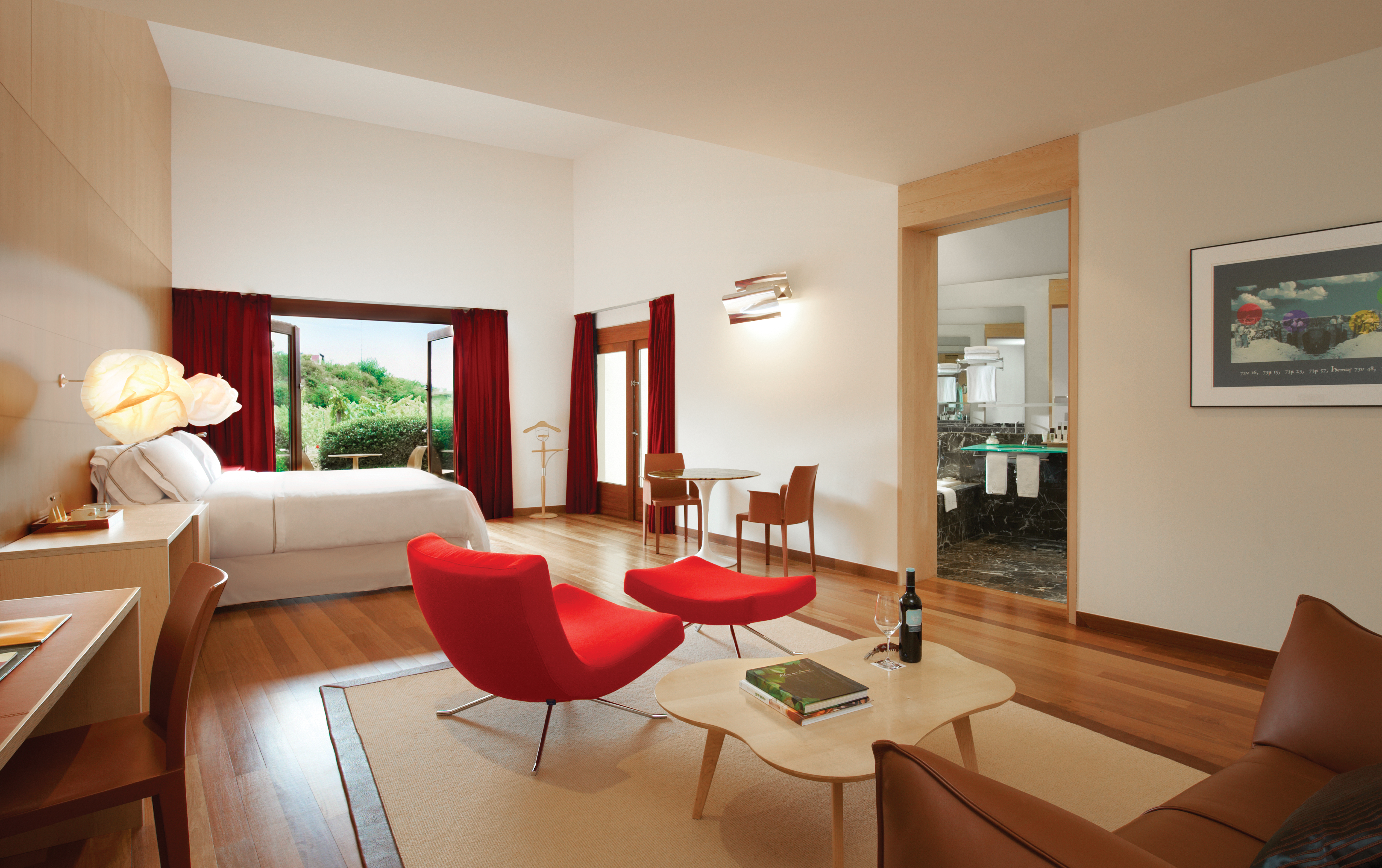 Executive suite with double doors opening out onto a terrace balcony