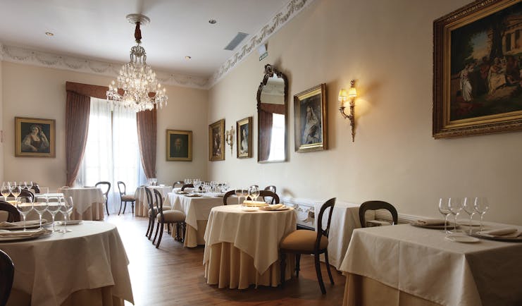Palacio Guendulain Basque restaurant indoor dining area chandelier artwork elegant décor