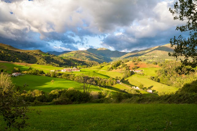 Rolling hills with cloudy sky and shadow in the foothills of the Pyrenees in Spanish Basque country
