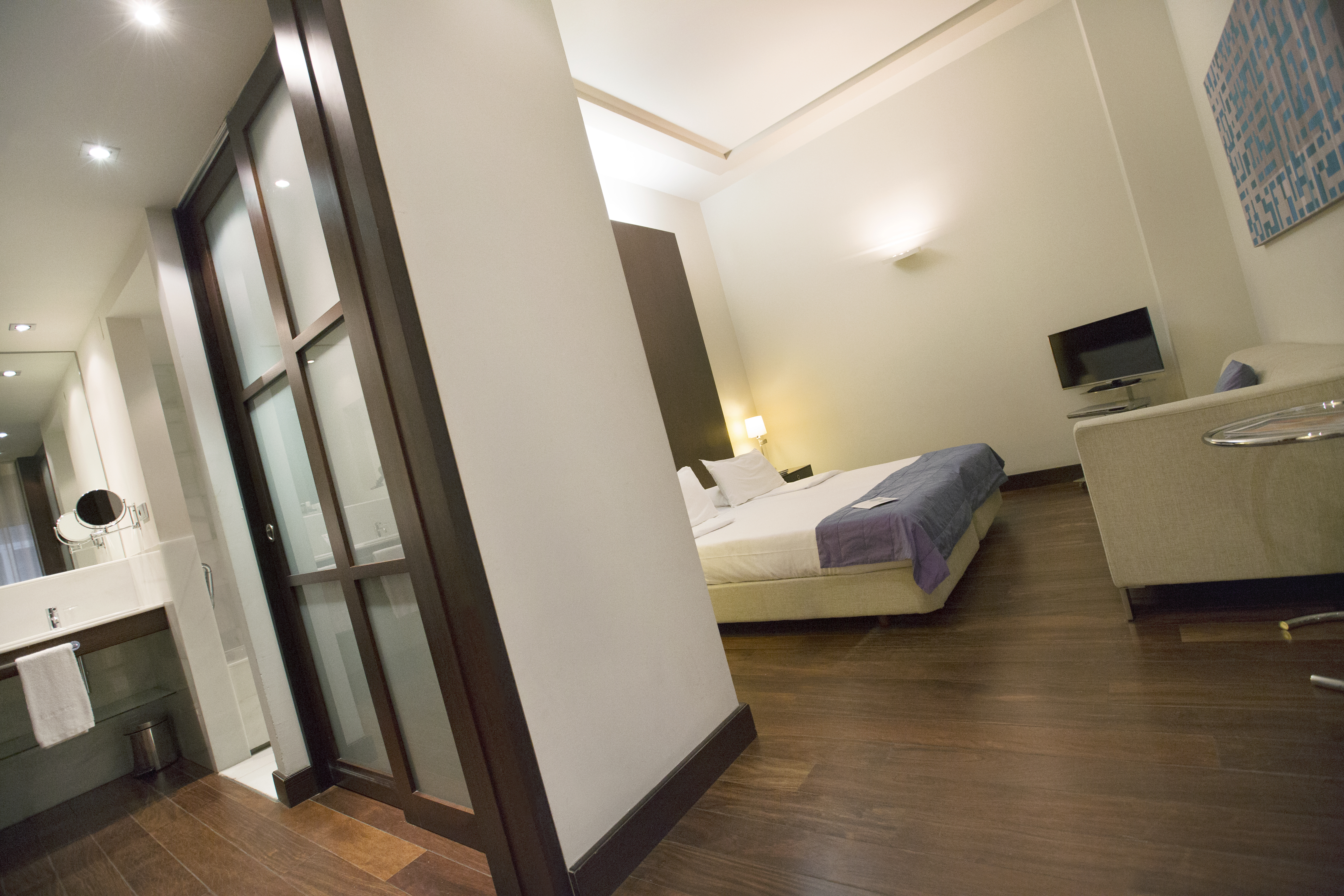 Hospes Amerigo Alicante white walls and wooden floors of dreamer bedroom