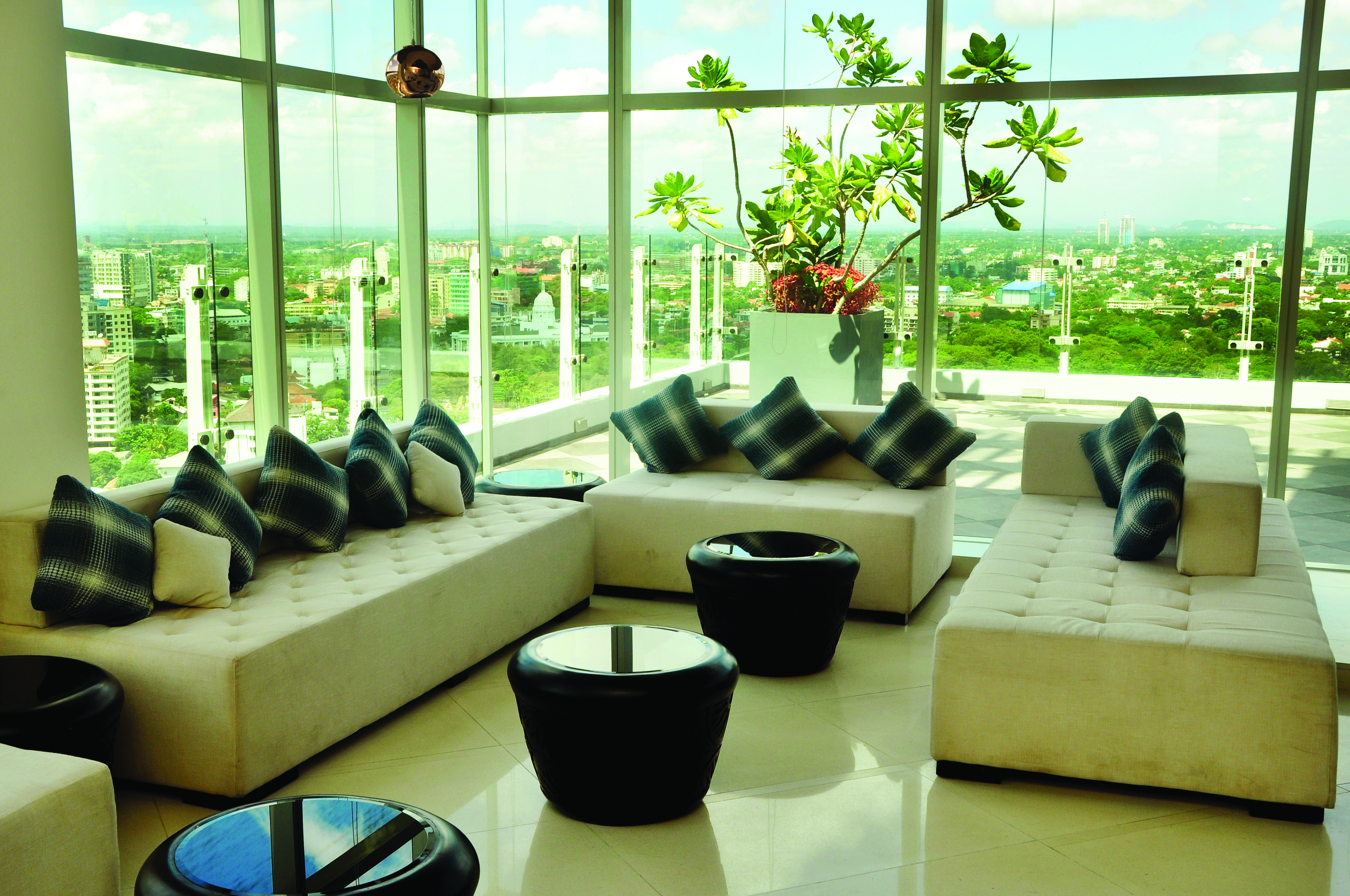 Cinnamon Red Sri Lanka lobby indoor seating area large glass windows view over city