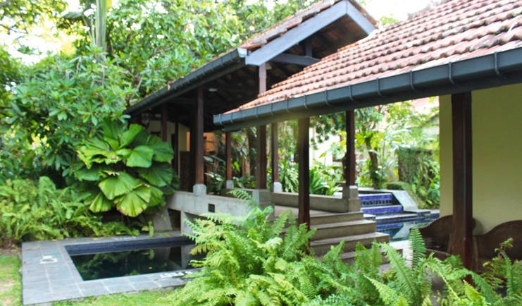 Havelock Place Bungalow Sri Lanka garden pool stone bridge blue tiles