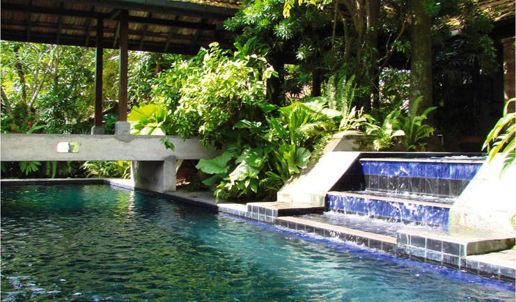 Havelock Place Bungalow Sri Lanka pool with blue tiles stone bridge and plants