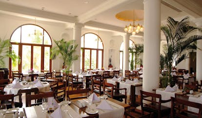 Mount Lavinia Hotel Sri Lanka Governor's restaurant indoor dining area large windows palms