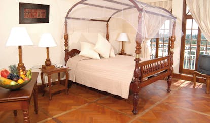 Mount Lavinia Hotel Sri Lanka Governor's wing suite four poster bed desk with fruit