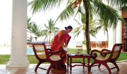 Mount Lavinia Hotel Sri Lanka inner terrace woman in saree serving afternoon tea 