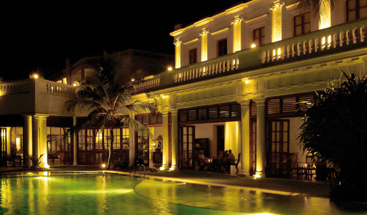 Mount Lavinia Hotel Sri Lanka pool terrace white building with terrace next to pool at night