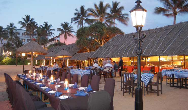 Mount Lavinia Hotel Sri Lanka Seafood Cove outdoor dining area thatched roof evening