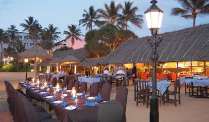 Mount Lavinia Hotel Sri Lanka Seafood Cove outdoor dining area thatched roof evening