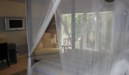 Paradise Road Tintagel Sri Lanka suite bedroom four poster bed armchair and balcony