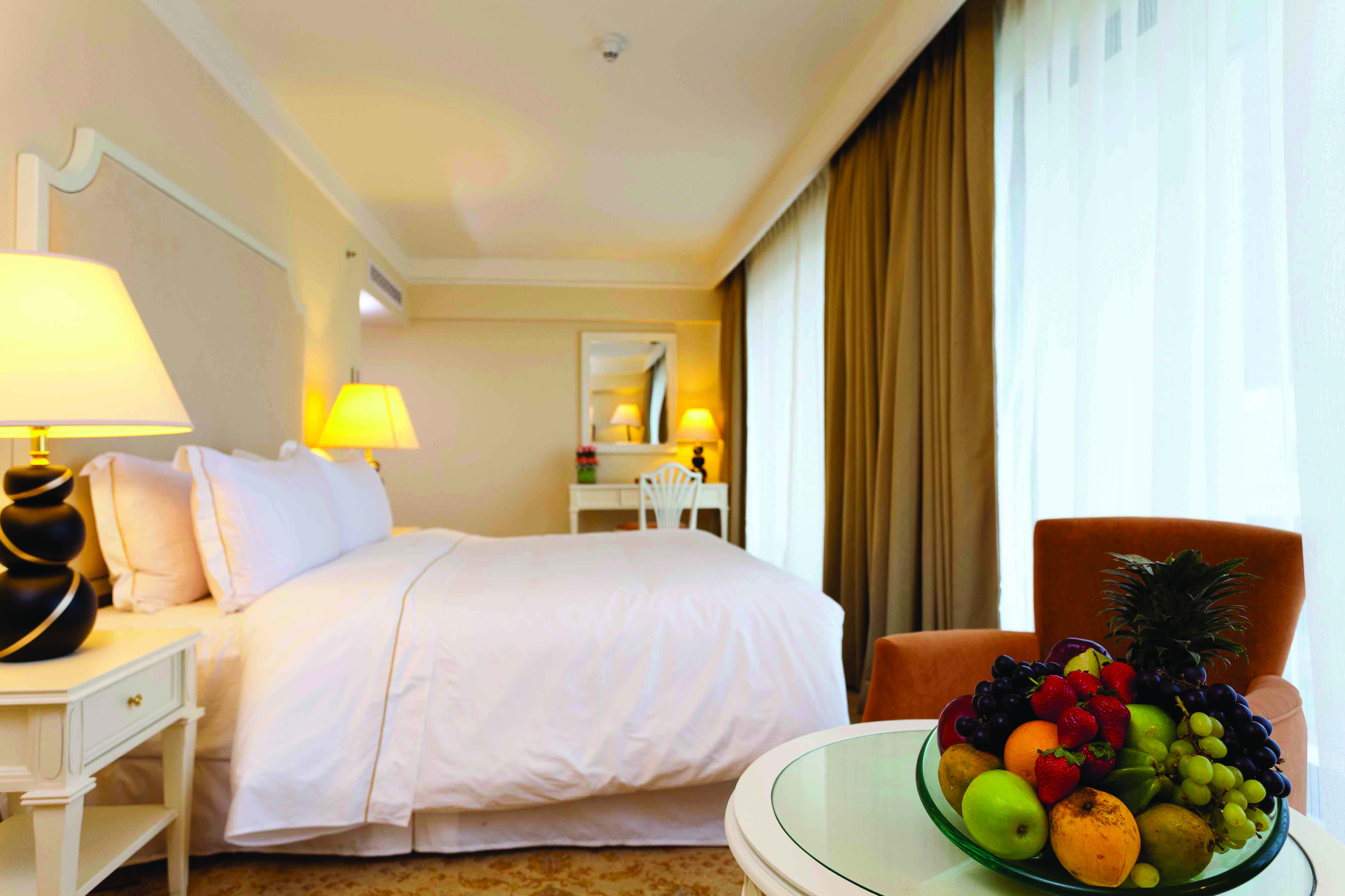 The Kingsbury Sri Lanka deluxe room bed table modern décor