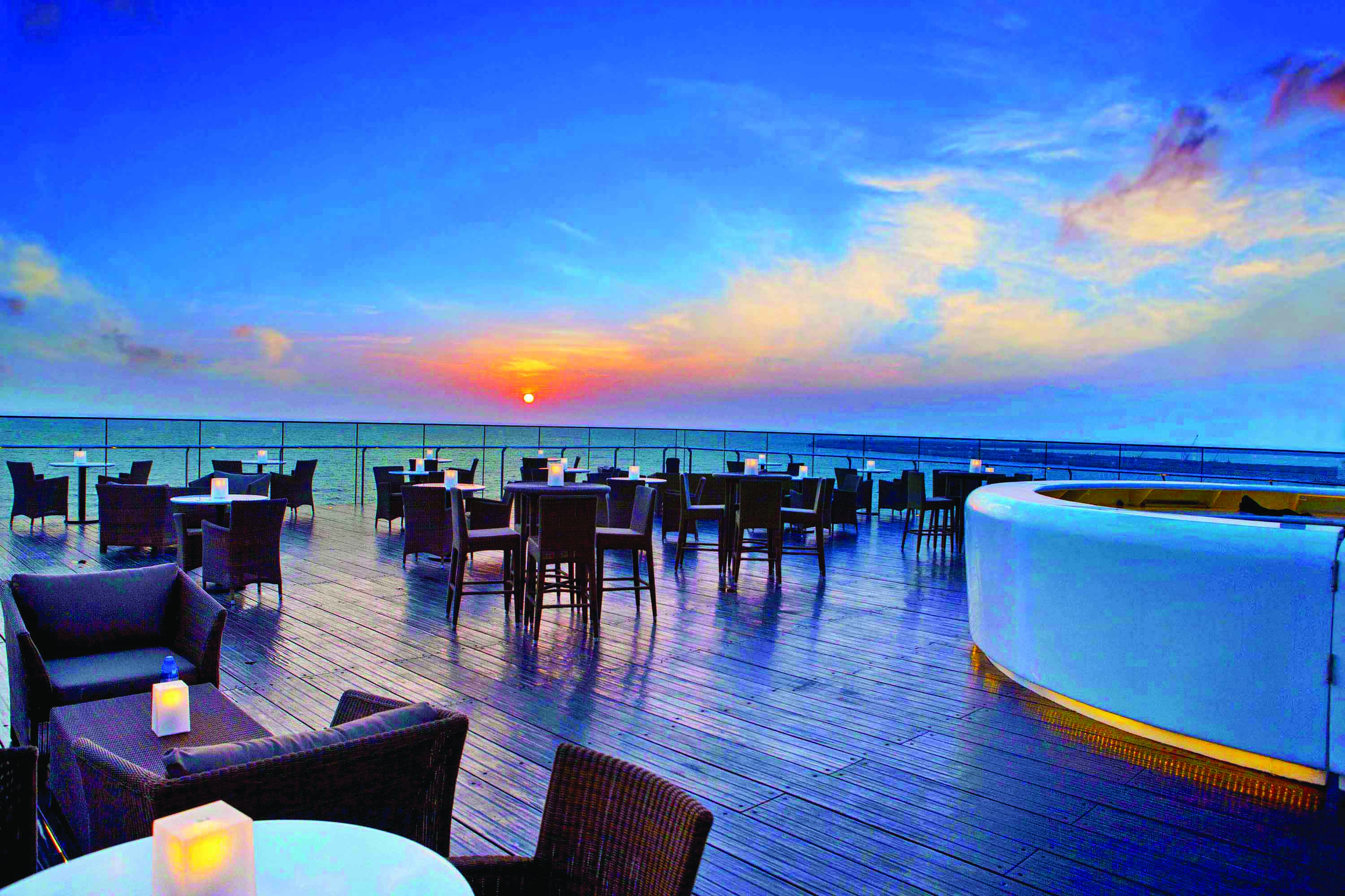 The Kingsbury Sri Lanka terrace at sunset outdoor seating area overlooking the sea