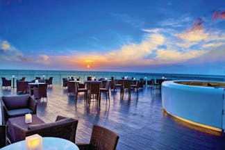 The Kingsbury Sri Lanka terrace at sunset outdoor seating area overlooking the sea