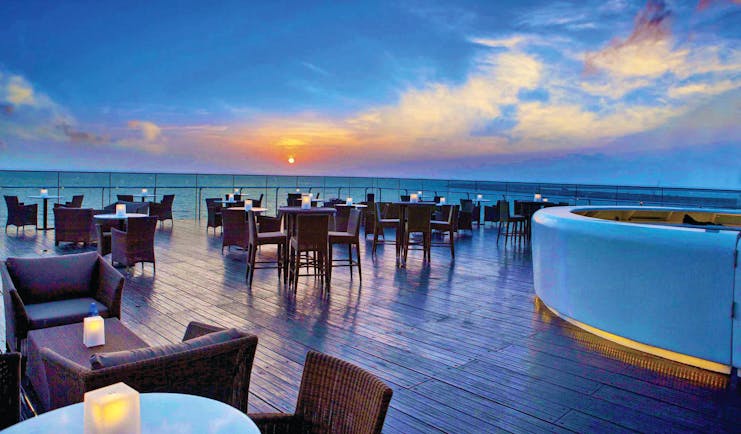 The Kingsbury Sri Lanka terrace at sunset outdoor seating area overlooking the sea