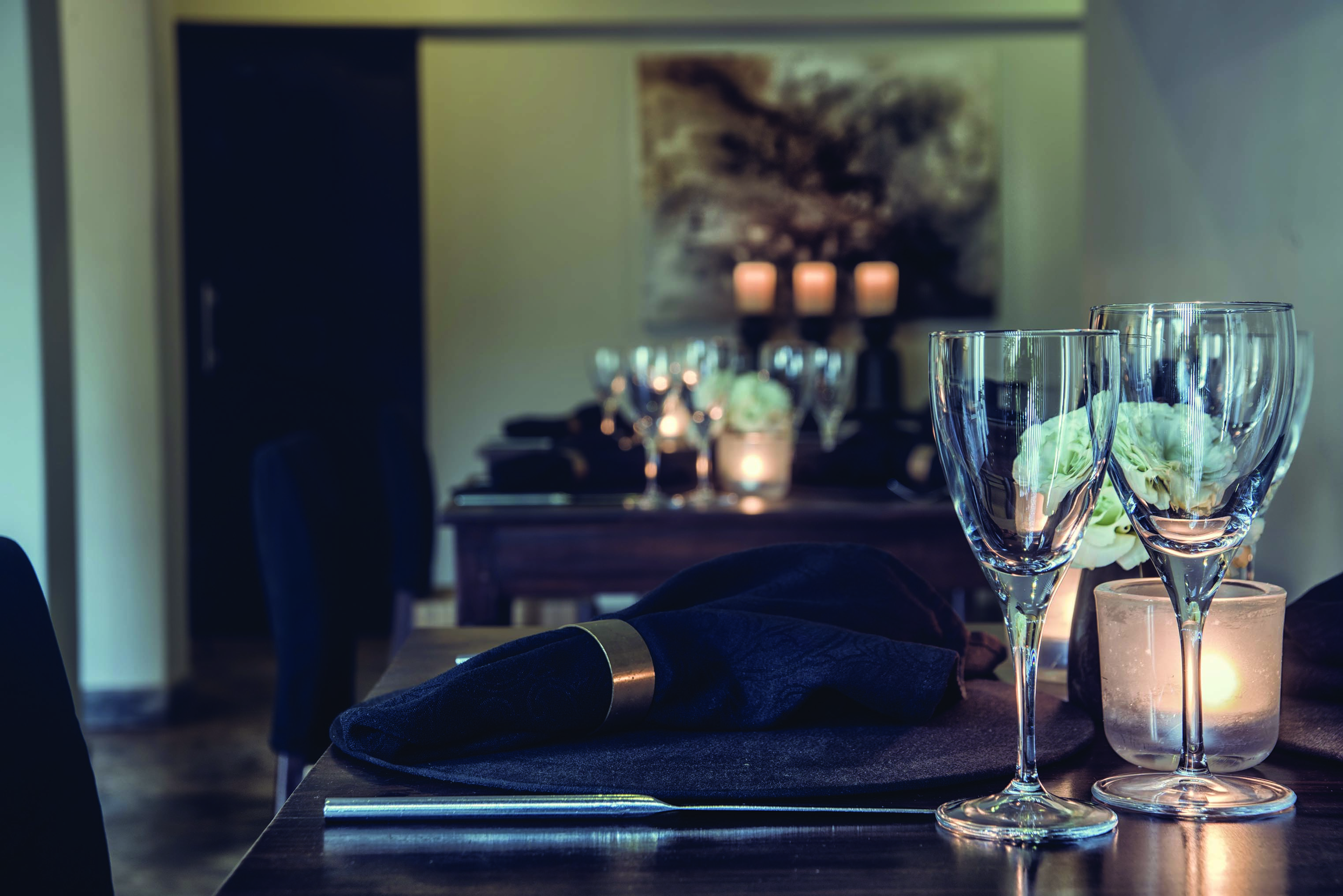 Dining experience at The Lake Lodge with dining tables set out and candles lit