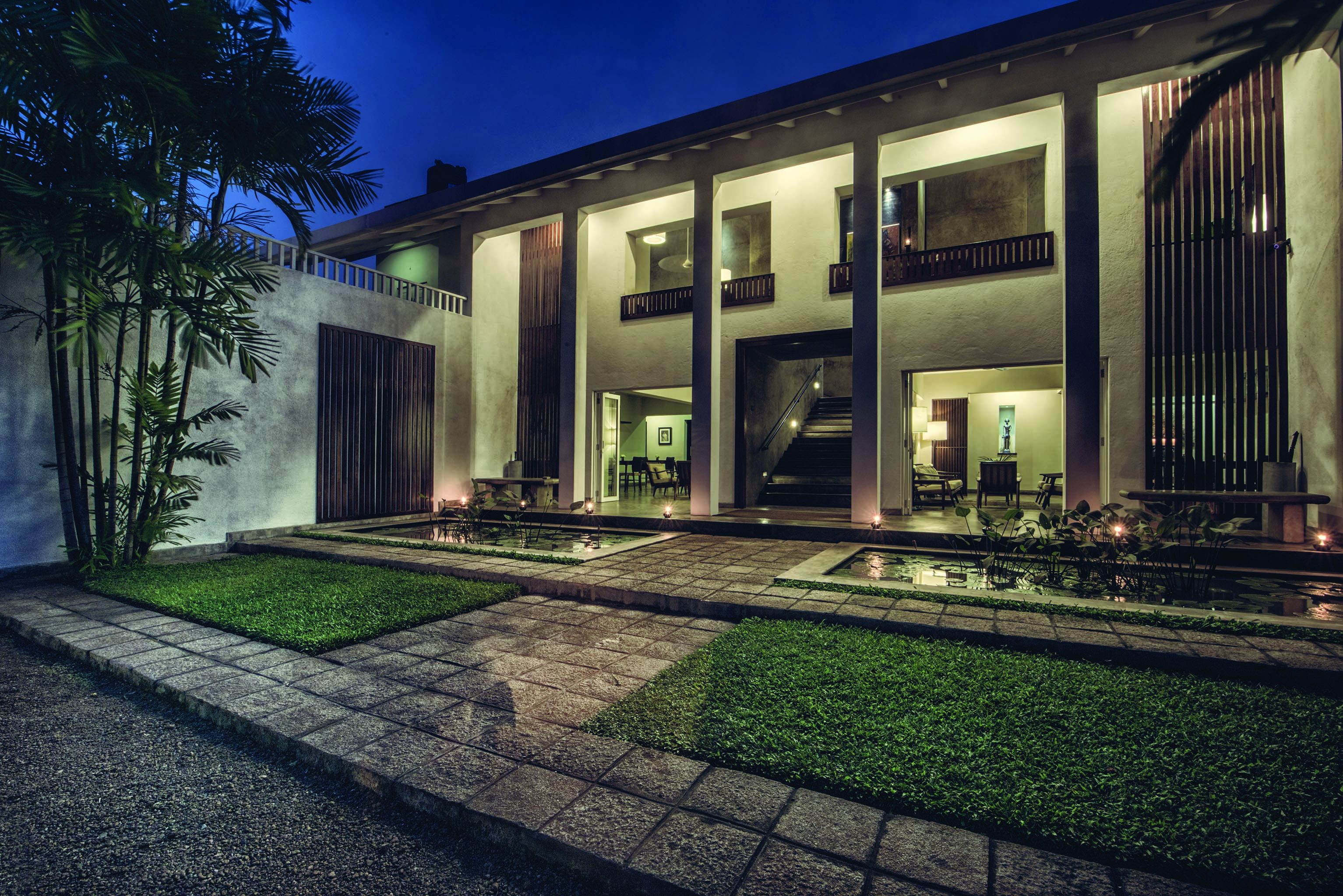 The Lake Lodge entrance, lawn, ponds, modern architecture, building lit up