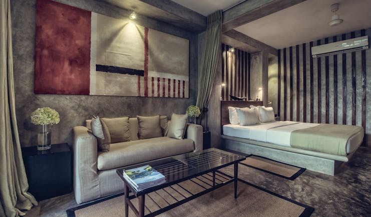 The Lake Lodge garden suite, double bed, sofa, modern decor in muted tones