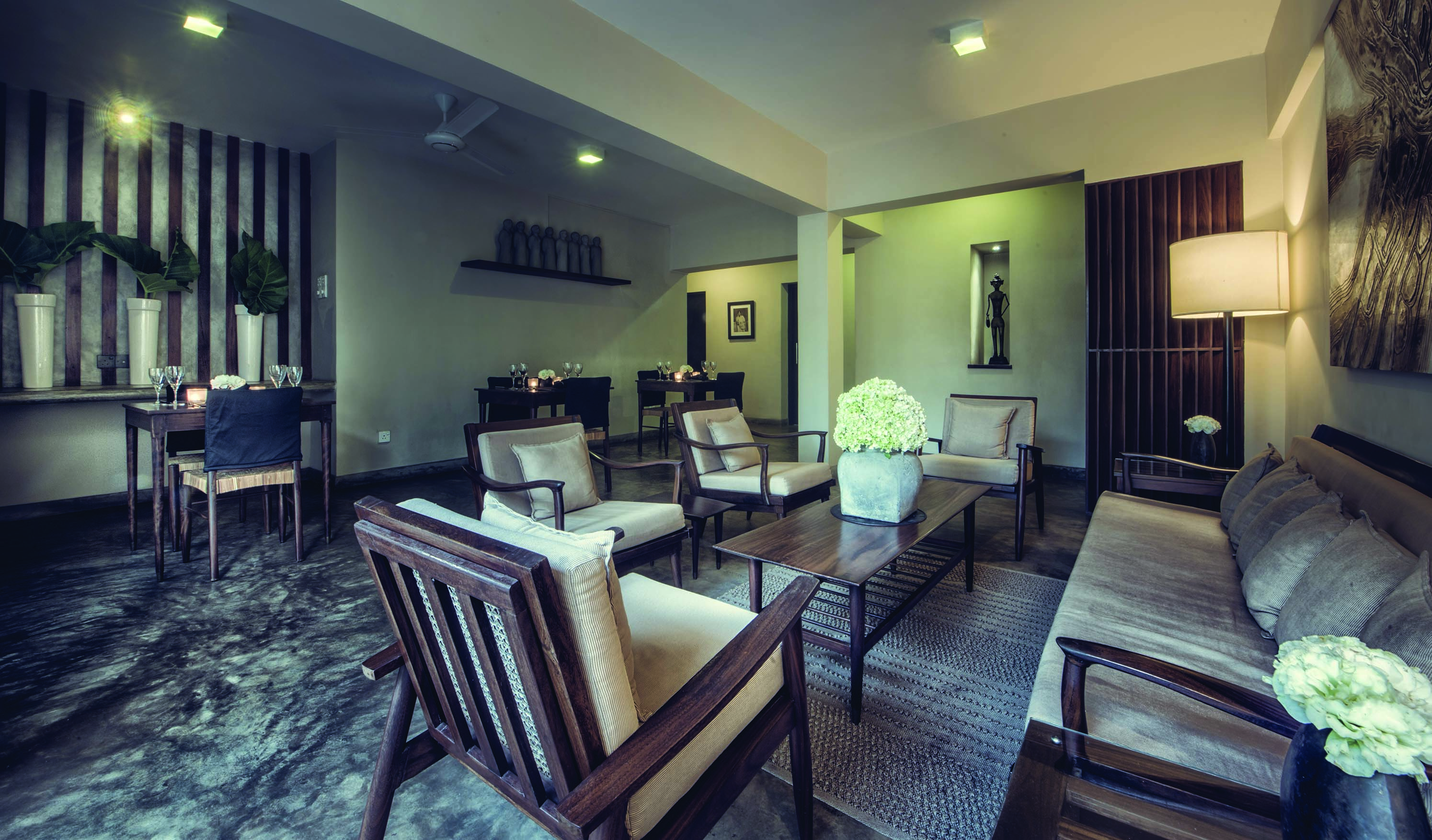 The Lake Lodge lounge, indoor seating area, sofa, armchairs, modern decor in muted tones