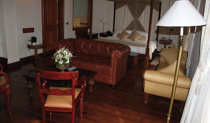 Galle Face Hotel Sri Lanka bedroom lounge sofa chairs chaise longue four poster bed
