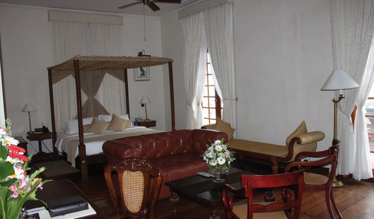 Galle Face Hotel Sri Lanka bedroom four poster bed leather sofa chaise longue 