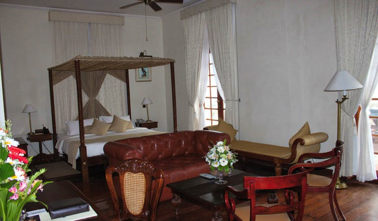 Galle Face Hotel Sri Lanka bedroom four poster bed leather sofa chaise longue 