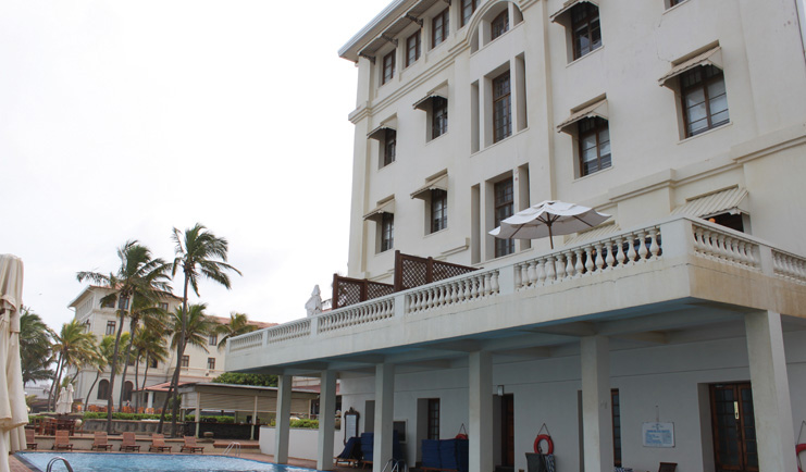 Galle Face Hotel Sri Lanka exterior pool hotel balcony loungers and palms