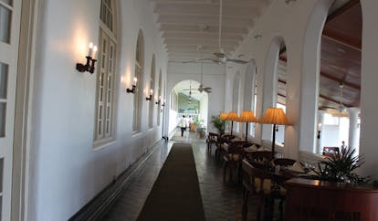 Galle Face Hotel Sri Lanka indoor terrace with tables and lamps