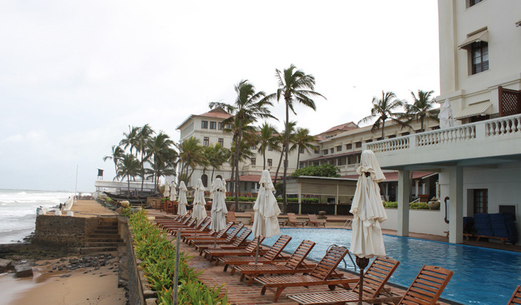 Galle Face Hotel Sri Lanka outdoor pool overlooking the beach loungers and umbrellas