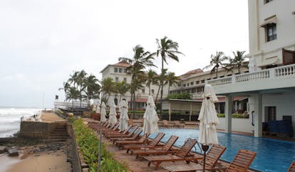 Galle Face Hotel Sri Lanka outdoor pool overlooking the beach loungers and umbrellas