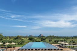 Aliya Sri Lanka infinity pool views across countryside mountains in distance