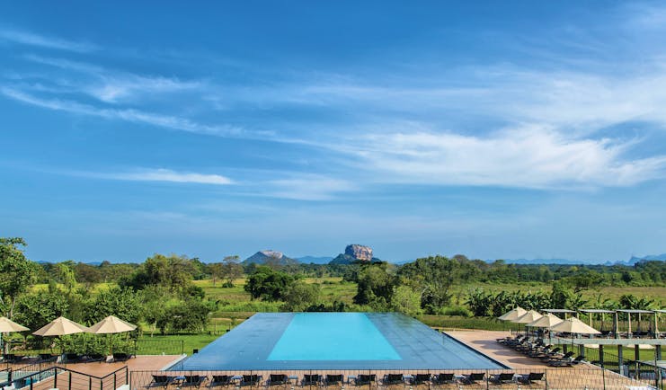 Aliya Sri Lanka infinity pool views across countryside mountains in distance