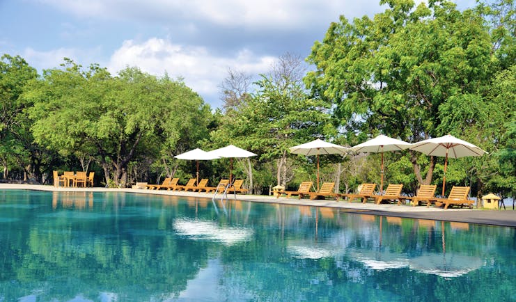 Amaya Lake Resort Sri Lanka pool sun loungers umbrellas
