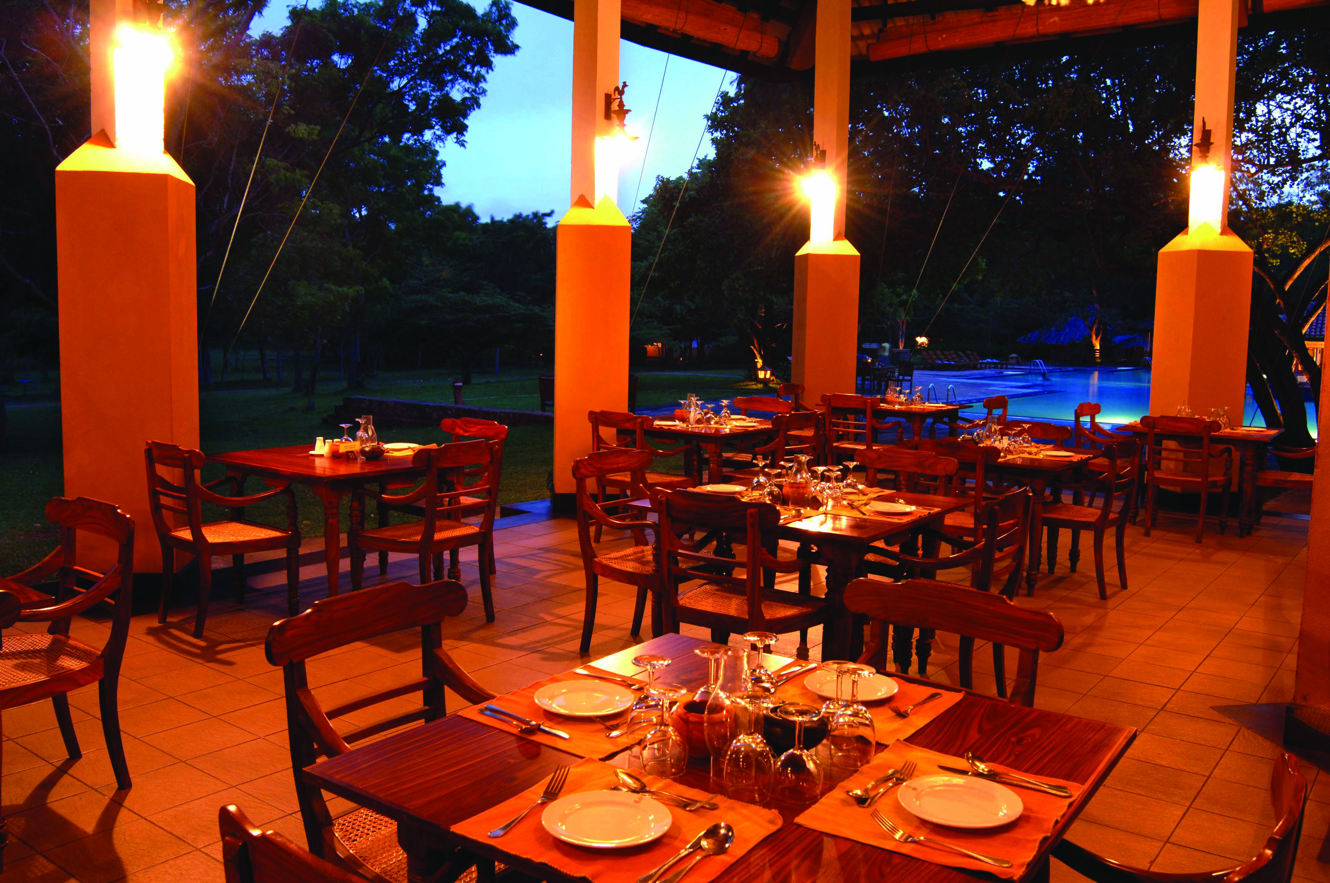 Amaya Lake Resort Sri Lanka restaurant patio outdoor dining area overlooking pool