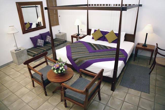 Chaaya Village Sri Lanka four poster bed armchairs modern décor