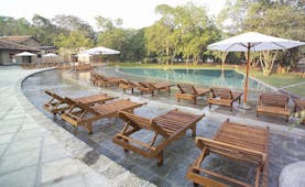 Chaaya Village Sri Lanka pool terrace sun loungers umbrellas