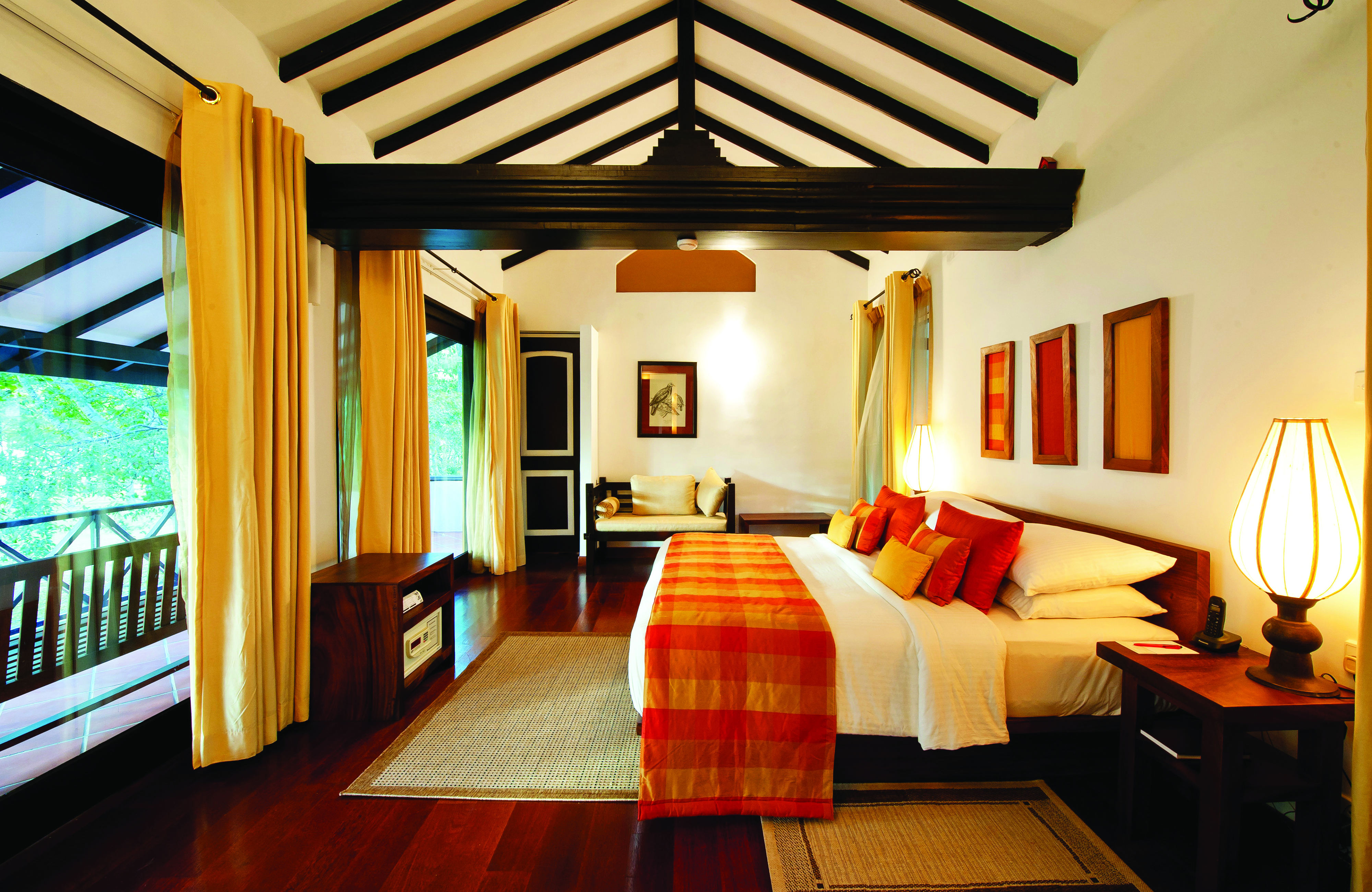 Cinnamon Lodge Sri Lanka deluxe suite bed sofa large windows bright modern décor
