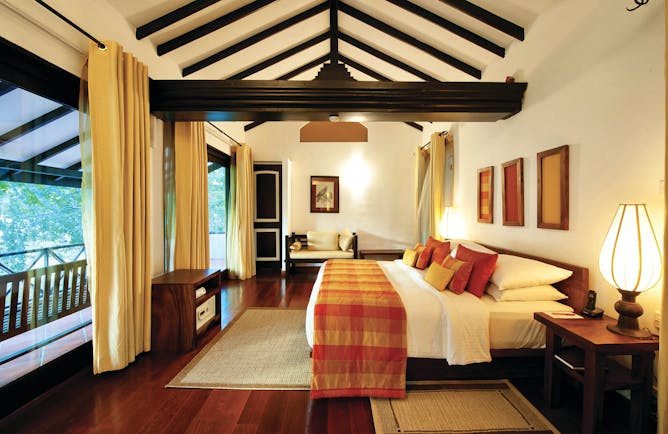Cinnamon Lodge Sri Lanka deluxe suite bed sofa large windows bright modern décor