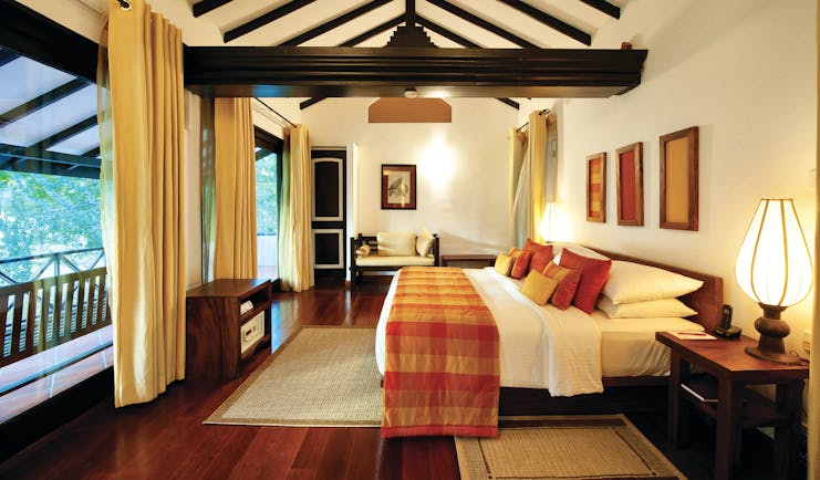 Cinnamon Lodge Sri Lanka deluxe suite bed sofa large windows bright modern décor