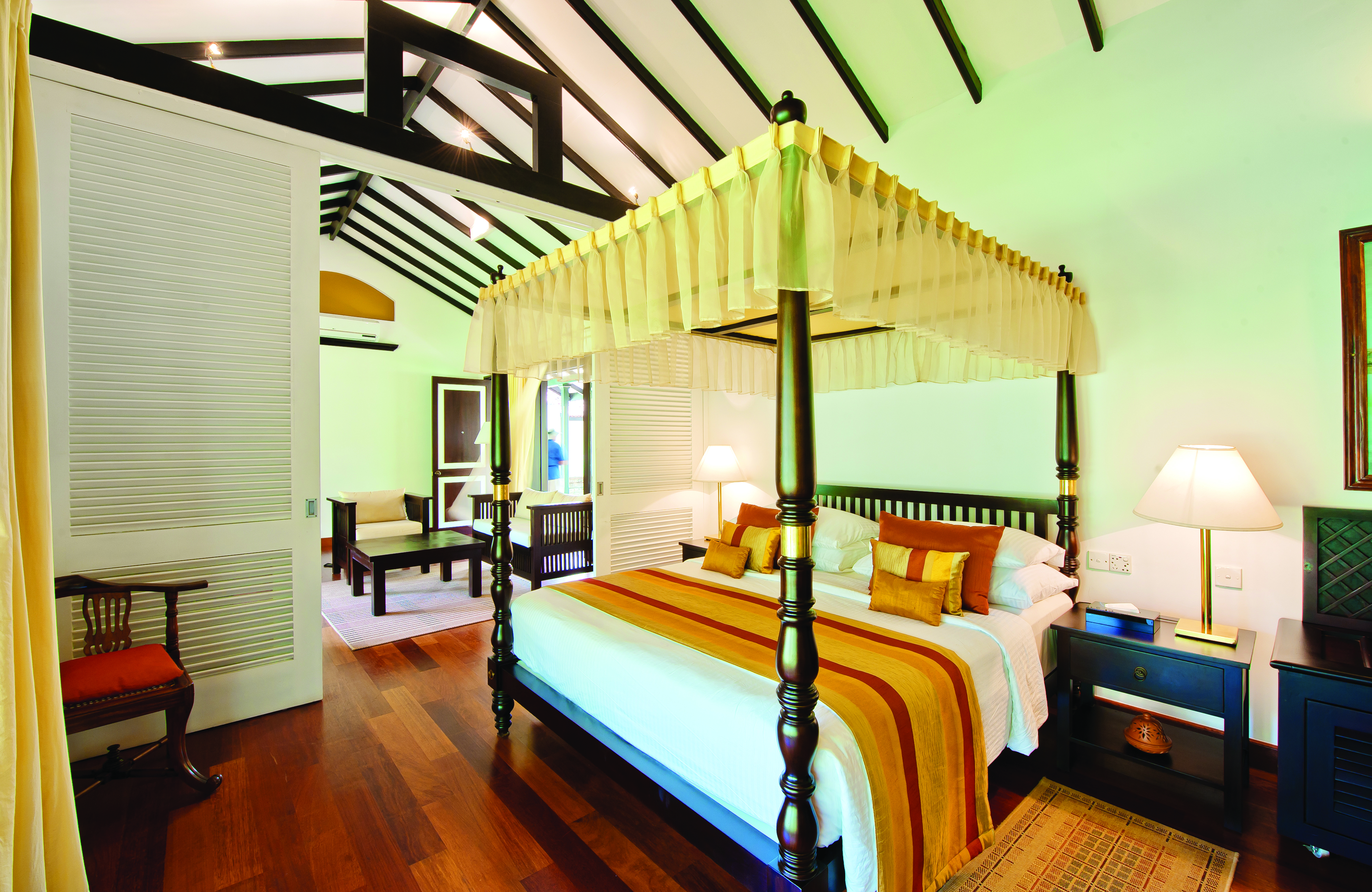 Cinnamon Lodge Sri Lanka superior suite canopied four poster bed separate living area modern décor