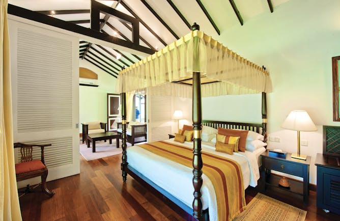 Cinnamon Lodge Sri Lanka superior suite canopied four poster bed separate living area modern décor