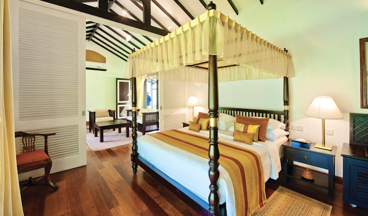 Cinnamon Lodge Sri Lanka superior suite canopied four poster bed separate living area modern décor
