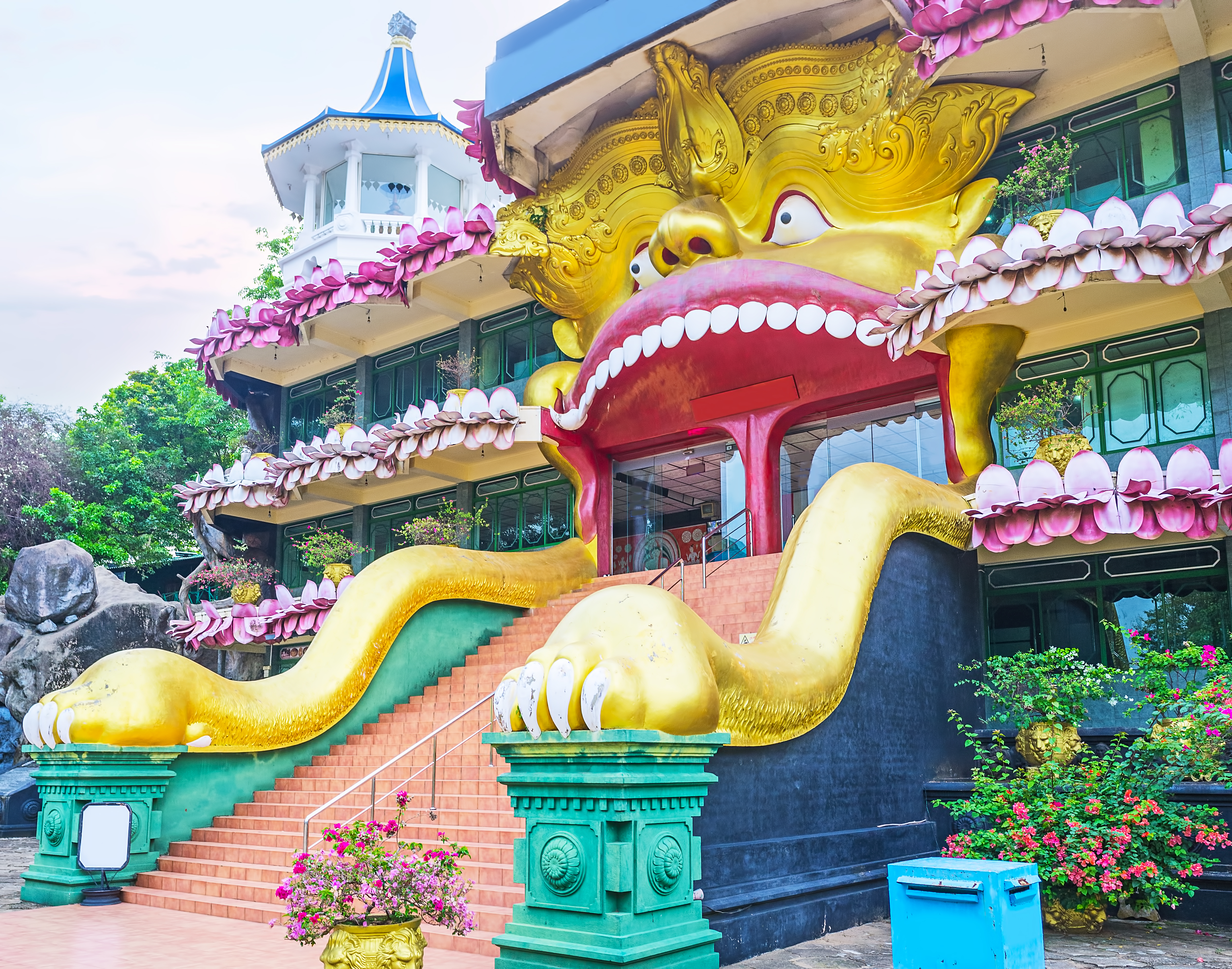 Dambulla Golden Temple entrance, colourful bright dragon carving, intricate design