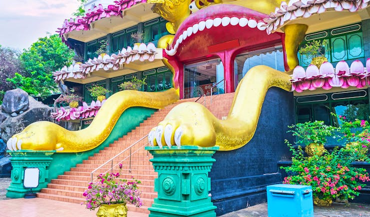Dambulla Golden Temple entrance, colourful bright dragon carving, intricate design