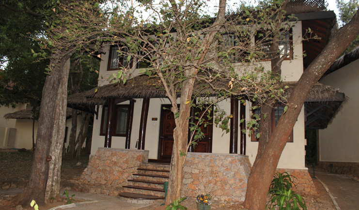 Deer Park Sri Lanka duplex cottage exterior stone steps building trees