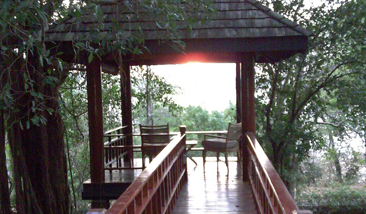 Deer Park Sri Lanka lookout view two chairs in a pagoda overlooking forest